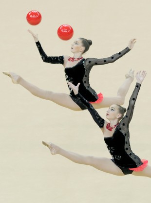 Two members of the Ukraine team perform during the Visa International Gymnastics.