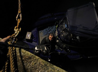 Garda divers prepare for a dive as the search continues for five people who went missing after the Tit Bonhomme trawler struck rocks and sunk in Cork in the early hours of Sunday morning.