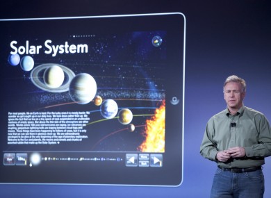 Apple's Philip Schiller displays some of the books available on the iBookstore at an event in New York today.