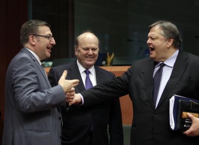 Michael Noonan (C) with his Belgian counterpart Steven Vanackers (L) and Greece's finance minister Evangelos Venizelos (R) at a summit in Brussels yesterday.