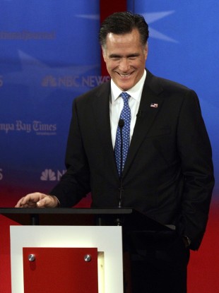 Romney smiles during a debate in Tampa, Florida last night.