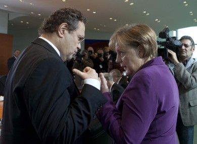 Hans-Peter Friedrich (left) has become the most senior member of Angela Merkel's cabinet to suggest that Greece should leave the eurozone.