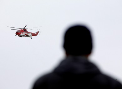 Mohammed Ali Eldin, father of missing trawlermen Saied Ali Eldin, watches a rescue helicopter take part in the search for the Tit Bomhomme last month