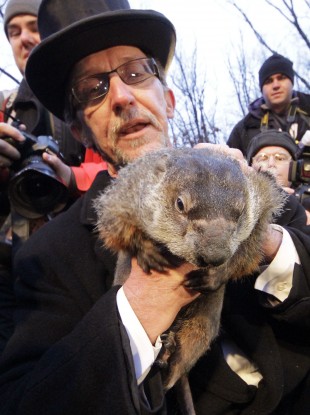 Groundhog Club handler Ron Ploucha holds Punxsutawney Phil, the weather prognosticating groundhog, during the 126th celebration of Groundhog Day on Gobbler's Knob in Punxsutawney, Pennsylvania earlier today