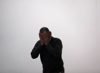 A man emerges from a tear gas cloud during recent clashes between police and protesters in Jidhafs, Bahrain.