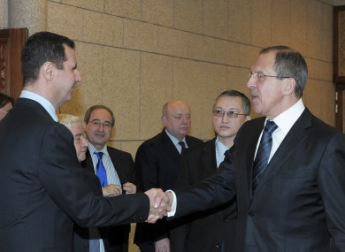 Bashar Assad, left, shakes hands with Russian Foreign Minister Sergei Lavrov, after talks in Damascus yesterday.