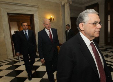 Leaders Lucas Papademos, George Papandreou and Antonis Samaras enter a meeting room in Athens today