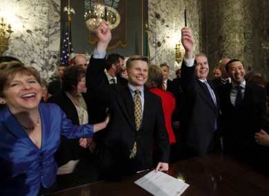 Politicians at the signing of the law yesterday in Olympia, Washington.