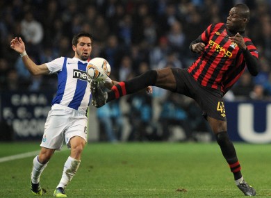 Balotelli challenges Joao Moutinho during the first leg.