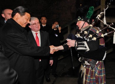 Chinese Vice-President Xi Jinping and Tanaiste Eamon GIlmore meet piper Neil Carey at Bunratty Castle.