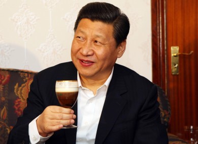 Xi Jinping samples one of farmer James Lynch's Irish coffees during a visit to the Lynch Farm at Six Mile Bridge in Clare yesterday.
