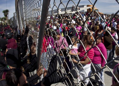 Police hold back the relatives of inmates outside the Apodaca correctional state facility as they try to get past the gates in Apodaca on the outskirts of Monterrey, Mexico.