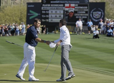 Lee Westwood of England, left, congratulates Rory McIlroy of Northern Ireland on his 3 and 2 semifinal win during the Match Play Championship golf tournament.