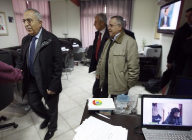 Palestinian Prime Minister Salam Fayyad, left, visits the offices of al-Watan TV after today's raid.