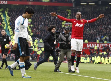 Patrice Evra celebrating under the nose of Luis Suarez.