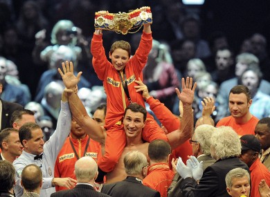 The Klitschkos celebrate with Alex, a young boxing fan from San Francisco.