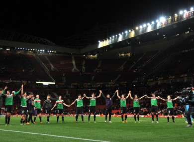 Athletic Bilbao players celebrate victory on the pitch after the match