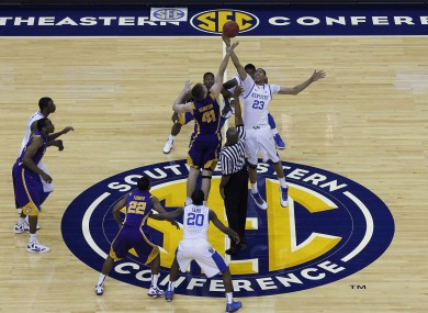 Kentucky forward Anthony Davis (23) controls the opening top against LSU center Justin Hamilton (41).
