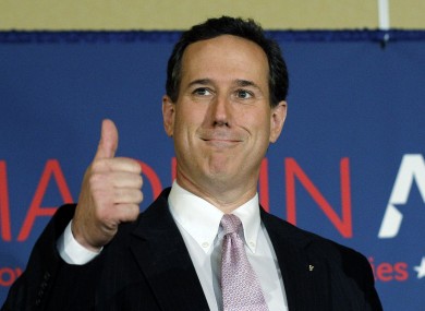 Republican presidential candidate, former Pennsylvania Sen. Rick Santorum gives a thumbs up during his election night party last night.