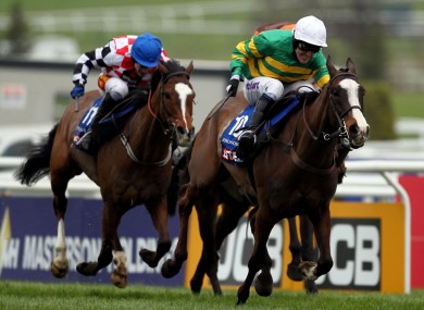 Tony McCoy on Synchronised as they go on to win the Betfred Cheltenham Gold Cup Steeple Chase.