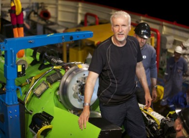 Cameron pictured in front of the Deep Challenger submarine.