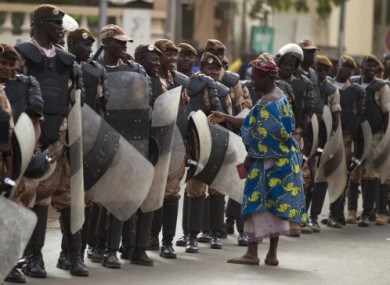 A woman talking with security forces during a march in support of the coup.
