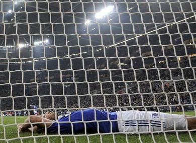 Schalke's Christian Fuchs lies in the goal during last night's 4-2 Europa League defeat at home to Athletic Bilbao.