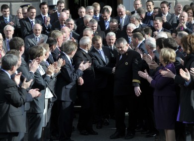 Fine Gael TDs applaud Enda Kenny after his election as Taoiseach. An event planned for today to mark the party's first year in power has been cancelled.