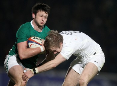 Ireland's Conor Finn is tackled by Charlie Walker.