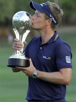 Luke Donald celebrates his victory with the trophy.
