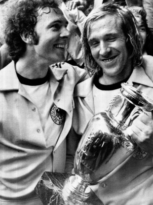 Franz Beckenbauer, left, and Gunter Netzer bask in the sweaty glory of triumph.