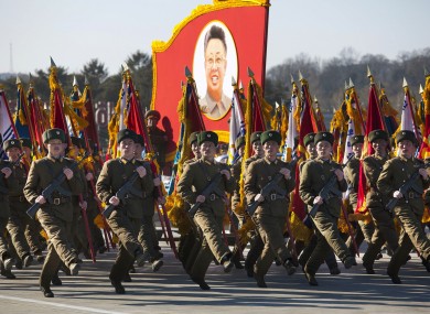 North Korean soldiers march and carry a portrait of the late North Korean leader Kim Jong Il during a military parade at Kumsusan Memorial Palace in Pyongyang.