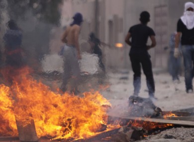 Anti-government protesters square up to riot police in Manama on Saturday.