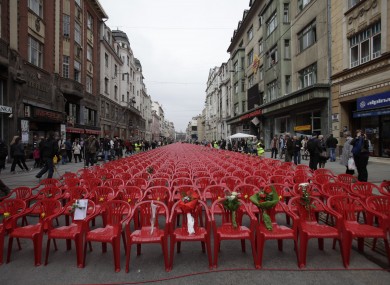Red chairs on the main street in Sarajevo representing the 11,541 Sarajevans killed during the siege