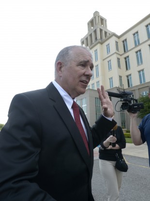 Hal Uhrig, one of two former attorneys for George Zimmerman, leaves a news conference after announcing that both attorneys had finished representing Zimmerman.