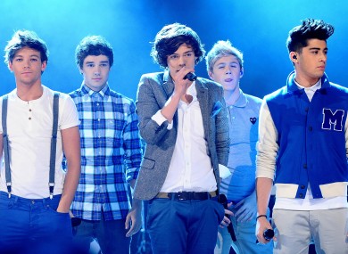 File photo dated 18/11/11 of One Direction performing