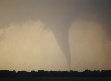 A tornado forms and touches down north of Soloman, Kansas, Saturday, April 14, 2012