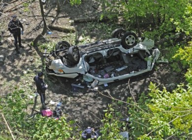 New York police investigate the wreck of yesterday's Bronx Zoo crash.