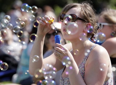Forever blowing bubbles... Franzi Blum from Germany amuses herself at the Dublin City Soul Festival at Merrion Square today.