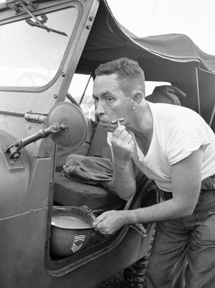 To be fair to this US National Guard sergeant in 1964, he at least got out of his vehicle to perform his morning ablutions...