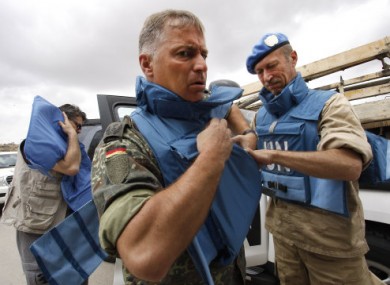UN observers prepare for their visit to Hama city today.