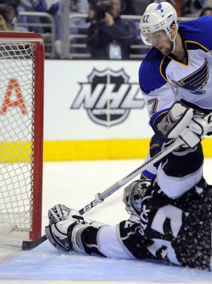 Los Angeles Kings goalie Jonathan Quick stops a shot by St. Louis Blues defenseman Alex Pietrangelo.