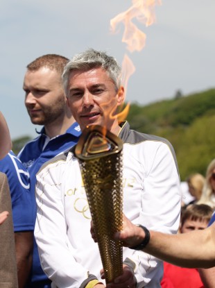 Jonathan Edwards holds the torch.
