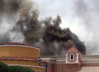 Smoke rising above the Villaggio Mall during yesterday's fire.