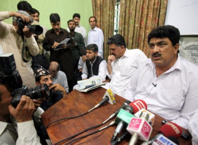 Jamil Afridi, right, brother of Shakil Afridi, speaks at a news conference in Peshawar on Monday.