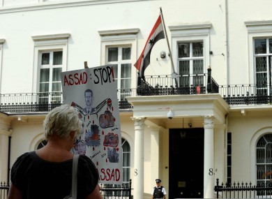 A protest sign outside the Syrian embassy in London today.