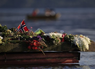 Floral tributes to the Utoya shooting victims, laid near the island last summer.