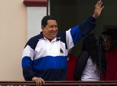 Chavez waves to his supporters from his Miraflores presidential palace in Caracas earlier this year.