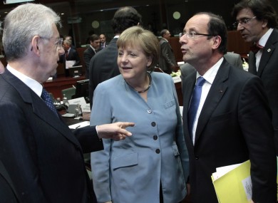 Angela Merkel (centre) is to meet Mario Monti (left) and Francois Hollande (right) later this week to consider allowing the ESM to buy the bonds of member countries.