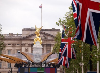 Work continues on the stage in front of the Victoria monument, and Buckingham Palace on the flag bedecked Mall, London, as preparations continue for the Jubilee celebrations.